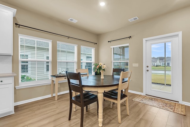 dining area with light hardwood / wood-style floors