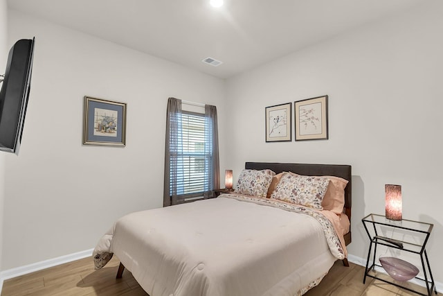 bedroom with light wood-type flooring