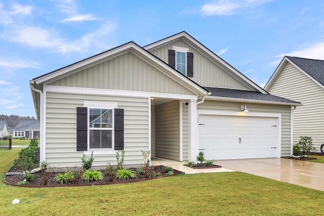 view of front of home featuring a garage and a front lawn