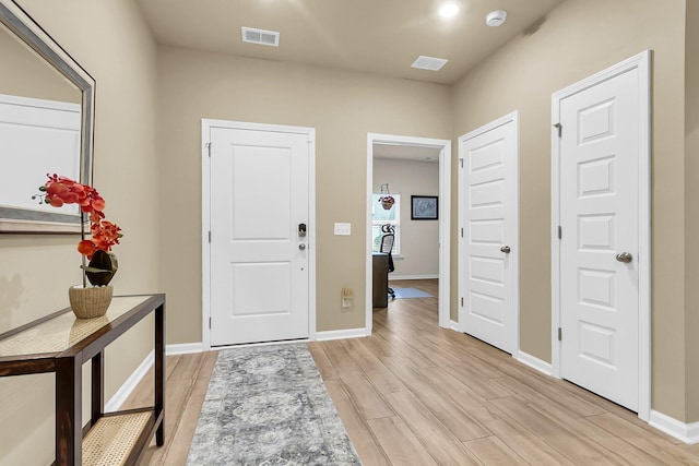 entrance foyer with light hardwood / wood-style floors