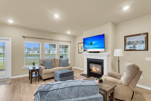 living room with light hardwood / wood-style flooring