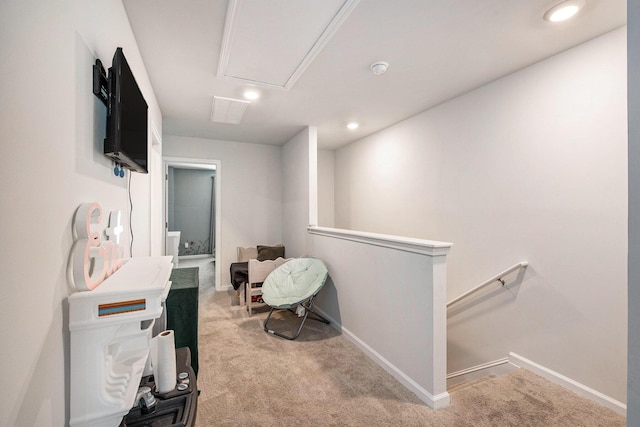 miscellaneous room with an upstairs landing, carpet, recessed lighting, attic access, and baseboards