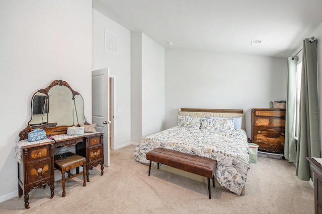 bedroom featuring carpet floors and baseboards
