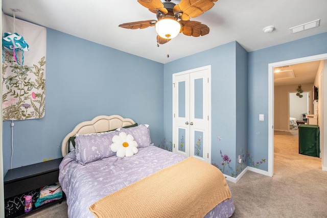 bedroom with carpet, a closet, baseboards, and ceiling fan