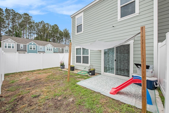 back of property with a patio