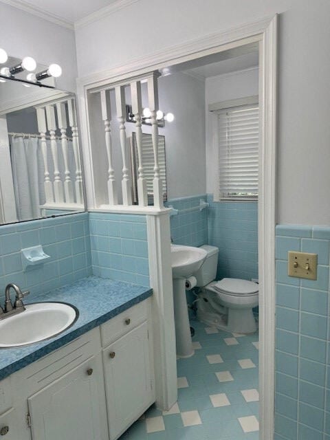 1153 Cherokee Dr, Manning, SC 29102 - full bath with tile walls, toilet, tile patterned floors, ornamental molding, and vanity