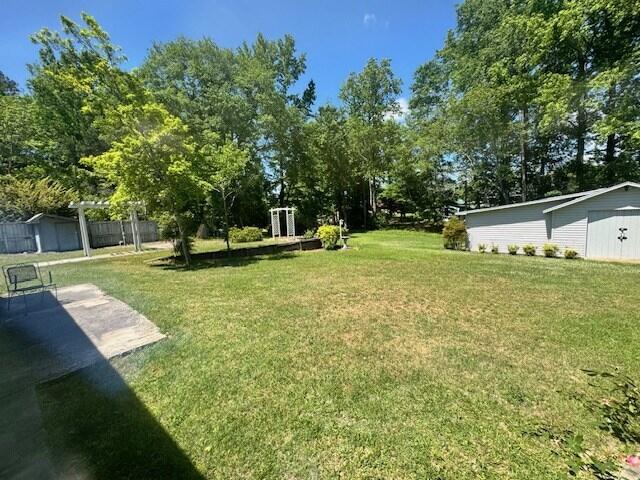 1153 Cherokee Dr, Manning, SC 29102 - view of grassy yard with view of scattered trees