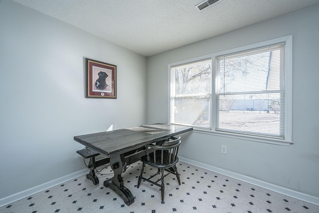 home office featuring a textured ceiling