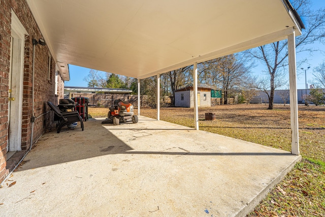 view of patio with an outbuilding