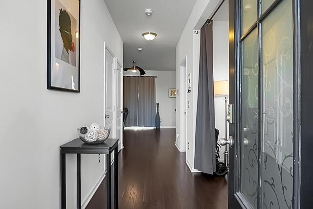 hall featuring dark wood-type flooring