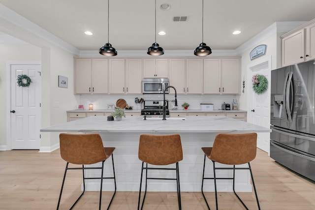 1576 Nautical Chart Dr, Charleston, SC 29414 - kitchen featuring fridge with ice dispenser, stainless steel microwave, a sink, tasteful backsplash, and ornamental molding
