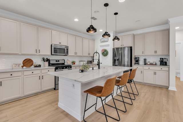 1576 Nautical Chart Dr, Charleston, SC 29414 - kitchen with appliances with stainless steel finishes, backsplash, a breakfast bar, light wood-type flooring, and ornamental molding