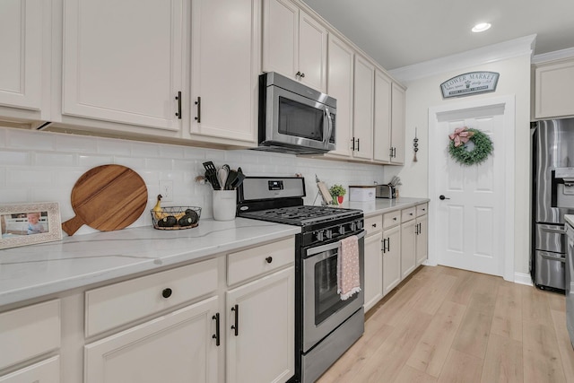 1576 Nautical Chart Dr, Charleston, SC 29414 - kitchen featuring stainless steel appliances, light wood finished floors, tasteful backsplash, light stone counters, and recessed lighting