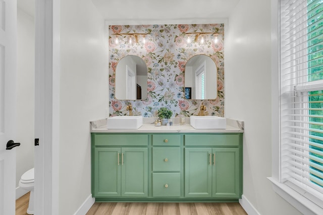 1576 Nautical Chart Dr, Charleston, SC 29414 - bathroom with wallpapered walls, double vanity, baseboards, wood finished floors, and toilet