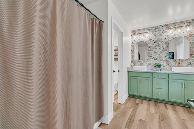 1576 Nautical Chart Dr, Charleston, SC 29414 - full bathroom with wallpapered walls, toilet, wood finished floors, double vanity, and a shower with shower curtain