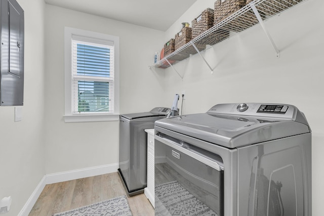 1576 Nautical Chart Dr, Charleston, SC 29414 - washroom with washing machine and clothes dryer, light wood-style floors, and baseboards