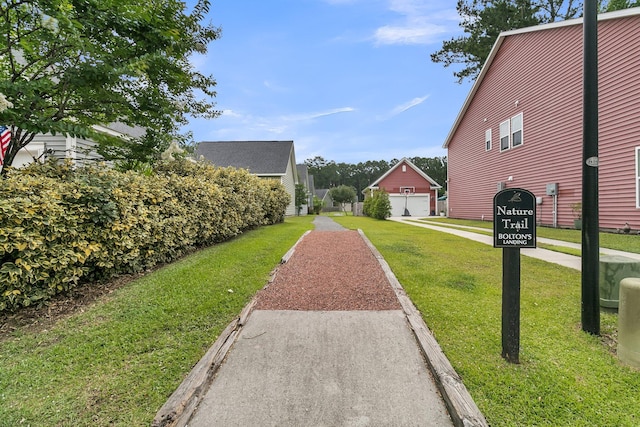 1576 Nautical Chart Dr, Charleston, SC 29414 - view of green lawn with a garage