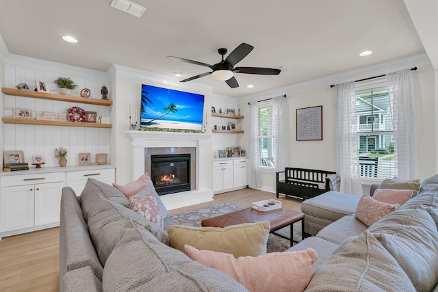 1576 Nautical Chart Dr, Charleston, SC 29414 - living room with light wood-style floors, a glass covered fireplace, ceiling fan, crown molding, and recessed lighting