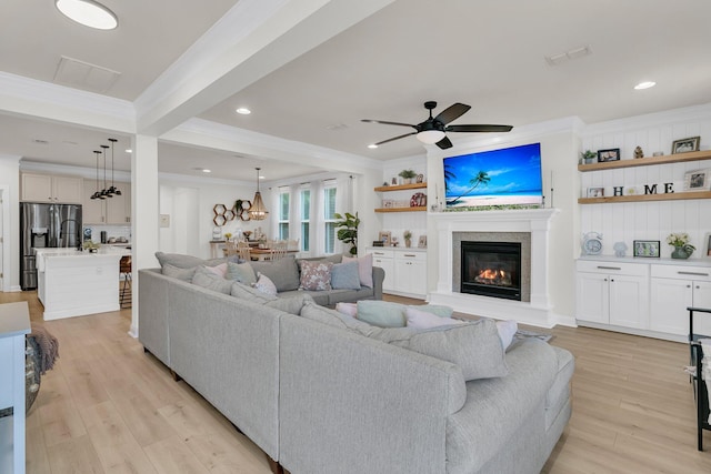 1576 Nautical Chart Dr, Charleston, SC 29414 - living room with crown molding, light wood finished floors, a glass covered fireplace, ceiling fan, and recessed lighting
