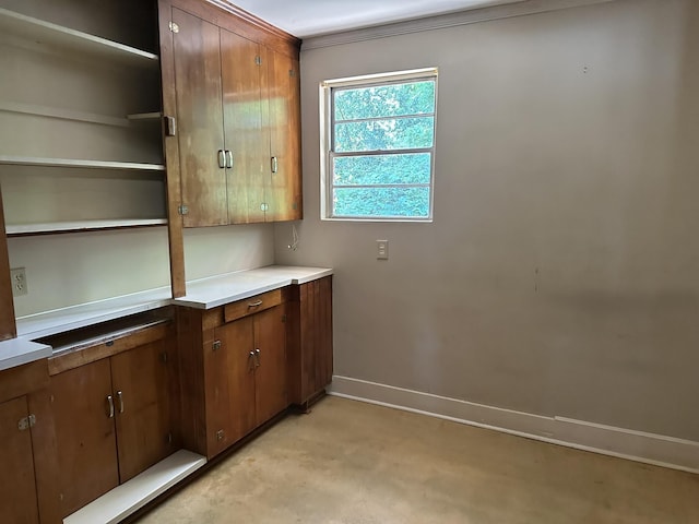 washroom with baseboards