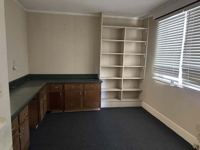 unfurnished office with baseboards and ornamental molding