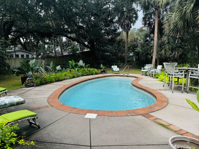 view of swimming pool featuring a patio area