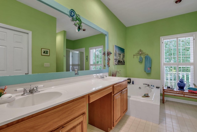 bathroom with tile patterned flooring, vanity, a healthy amount of sunlight, and independent shower and bath