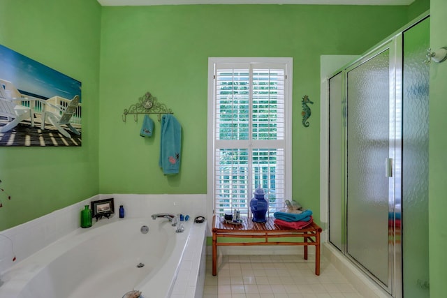 bathroom featuring shower with separate bathtub and tile patterned floors