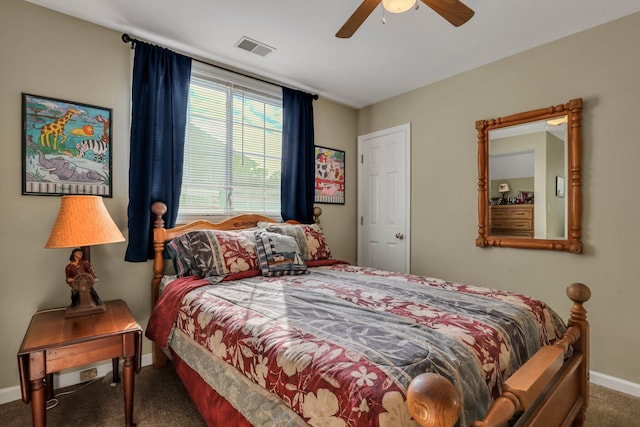 bedroom featuring dark colored carpet and ceiling fan