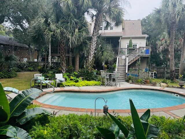 view of swimming pool with a patio area