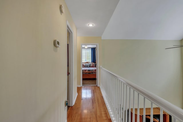 corridor with light hardwood / wood-style flooring