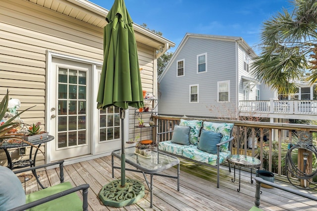 wooden deck with an outdoor hangout area