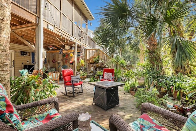 view of patio featuring a fire pit and a deck