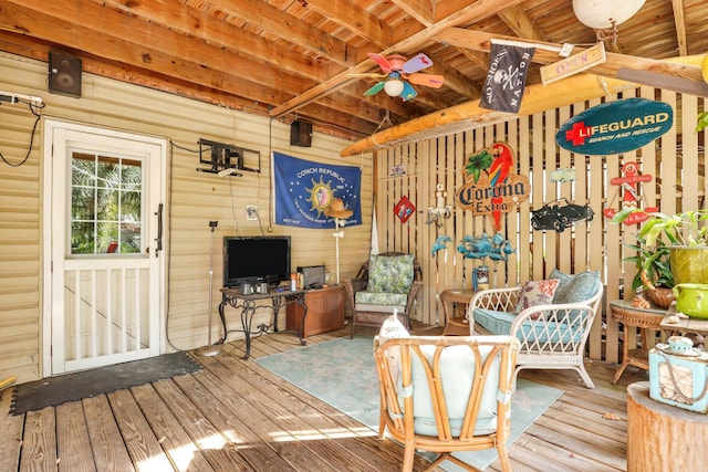 wooden deck featuring ceiling fan