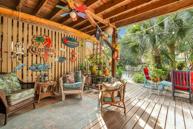 wooden terrace featuring ceiling fan