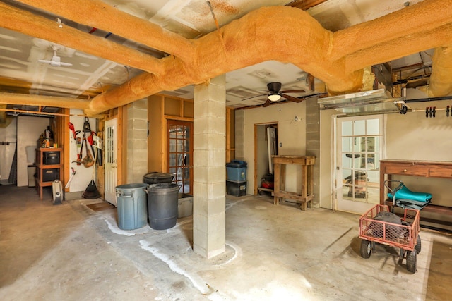 basement with ceiling fan