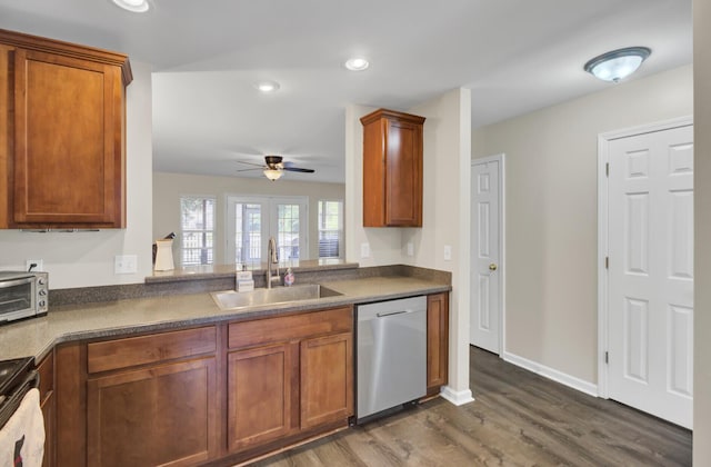 1005 Washitonia Way Unit B, Charleston, SC 29492 - kitchen featuring stainless steel dishwasher, a sink, dark wood-type flooring, dark countertops, and brown cabinets