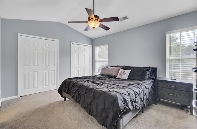 1005 Washitonia Way Unit B, Charleston, SC 29492 - bedroom with vaulted ceiling, light carpet, multiple closets, multiple windows, and ceiling fan