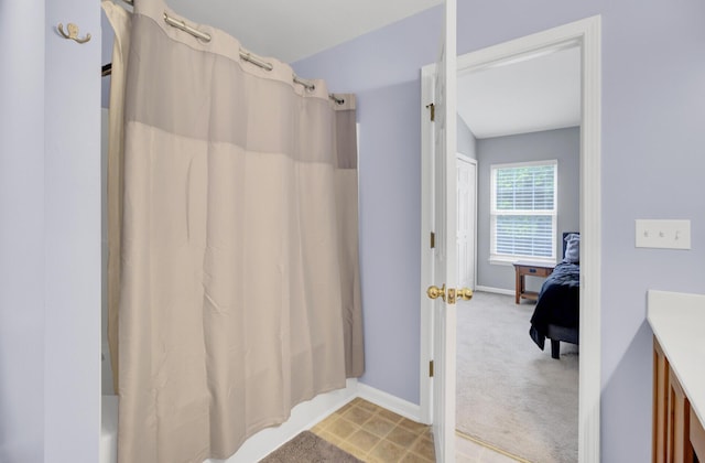 1005 Washitonia Way Unit B, Charleston, SC 29492 - full bathroom featuring baseboards, vanity, and shower / tub combo with curtain