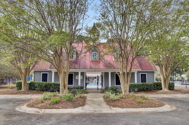 1005 Washitonia Way Unit B, Charleston, SC 29492 - cape cod home with metal roof and a porch