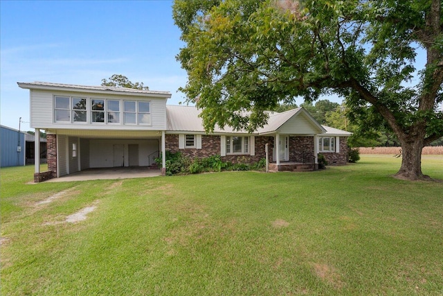 view of front facade with a carport and a front yard