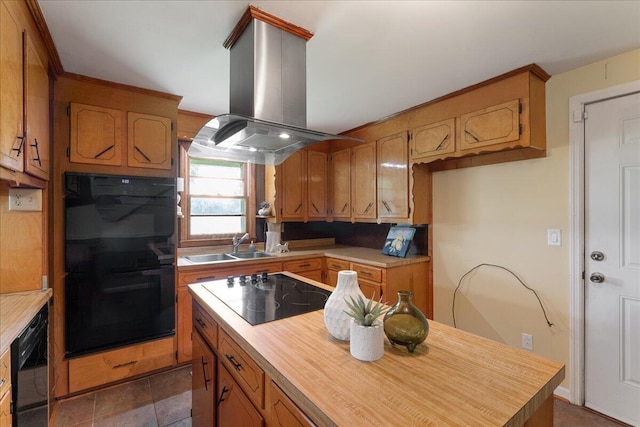 kitchen with island range hood, sink, and black appliances