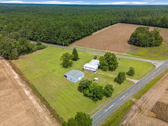 birds eye view of property with a rural view