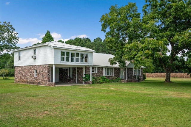 back of house featuring a yard