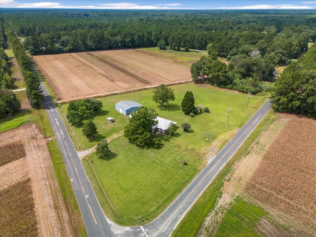 birds eye view of property featuring a rural view