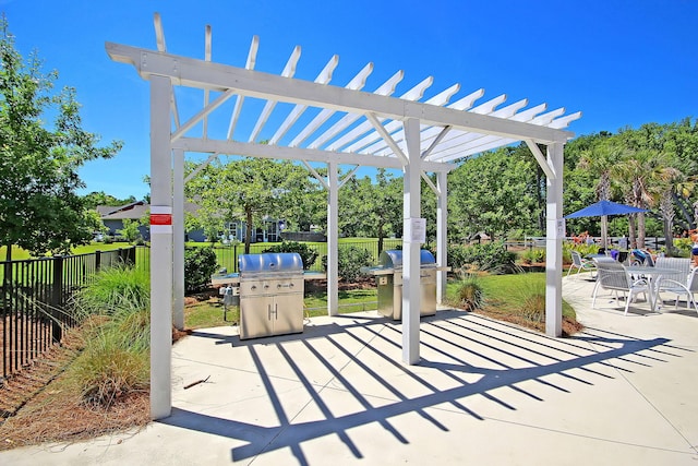 view of patio / terrace featuring a pergola and a grill