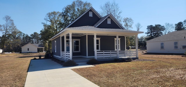 view of front facade with covered porch and a front yard