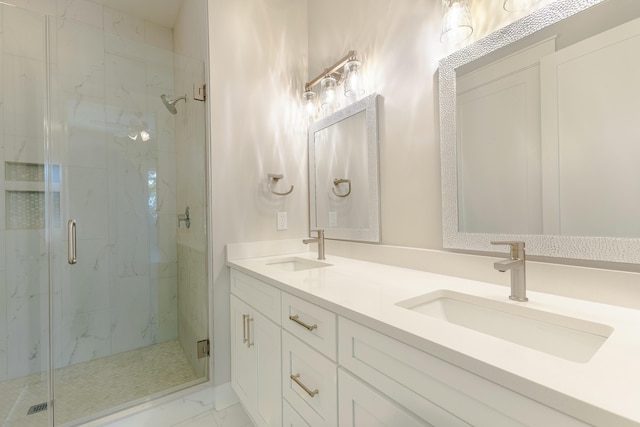 bathroom featuring marble finish floor, a sink, a marble finish shower, and double vanity