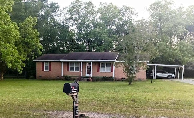 single story home featuring a carport and a front yard