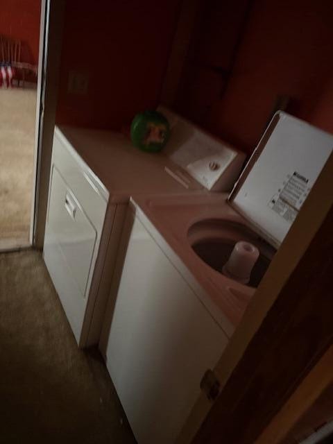 laundry room with separate washer and dryer